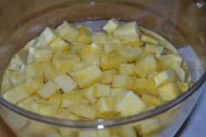 cut up pineapple in vodka for pineapple infused vodka