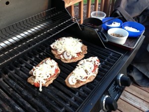pizzas on the grill